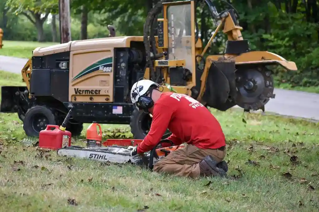 Penn West crew member preparing equipment for tree maintenance work in Mercer County, PA